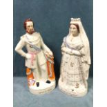 A pair of large Victorian flatback Staffordshire figures of Queen Victoria and the Prince of
