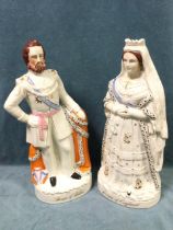 A pair of large Victorian flatback Staffordshire figures of Queen Victoria and the Prince of