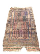 An antique Bokhara rug woven with field of rectangular arrowhead panels on madder ground framed by