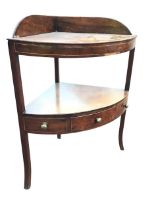A Georgian corner washstand, the bowfronted top with raised back above a conforming shelf with a