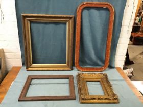Four C19th frames - a gilt gesso fluted cavetto with laurel leaf moulding - 28.5in x 24.5in, rounded