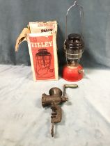 A boxed Tilley paraffin stormlight model X246B; and a Kenrick No 7 cast iron kitchen mincer with D-