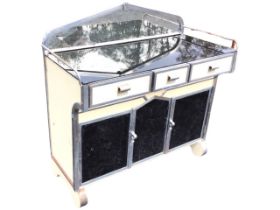 A deco painted and chromed sideboard, the pointed raised back and glass top flanked by rails,