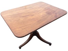A C19th mahogany tilt-top table, the rounded rectangular platform on a turned tapering column,