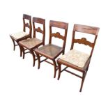 A set of four 19th century Dutch fruitwood dining chairs, the tablet backs above shaped inlaid rails