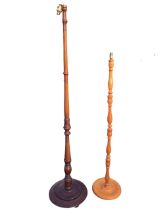 A turned mahogany standard lamp on a circular base raised on bun feet - 67in; and a bobbin &
