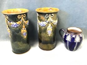 A pair of Doulton Lambeth stoneware vases decorated in relief with swags of flowers - 6in; and a