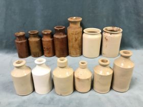 A collection of salt glazed stoneware bottles and jars, three marked Doulton Lambeth. (13)