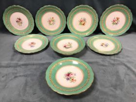 A Victorian porcelain dessert service, the six plates and two comports with green and gilt