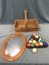 A pine trug with leaf carving to box rim, having turned handle; a set of pool balls with setting