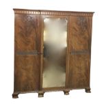 A late Victorian mahogany combination wardrobe by Sopwith & Co, with lozenge and pelmet cornice