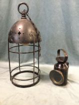 A railway type oil lamp with circular bevelled glass lens and oval colour changer; and a domed top