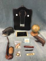 Miscellaneous collectors items - a globe pen stand, a bear moneybox, a Black Forest carved bear, a