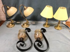 A pair of Victorian style brass desk lamps with hemispherical frosted glass shades and flowerhead