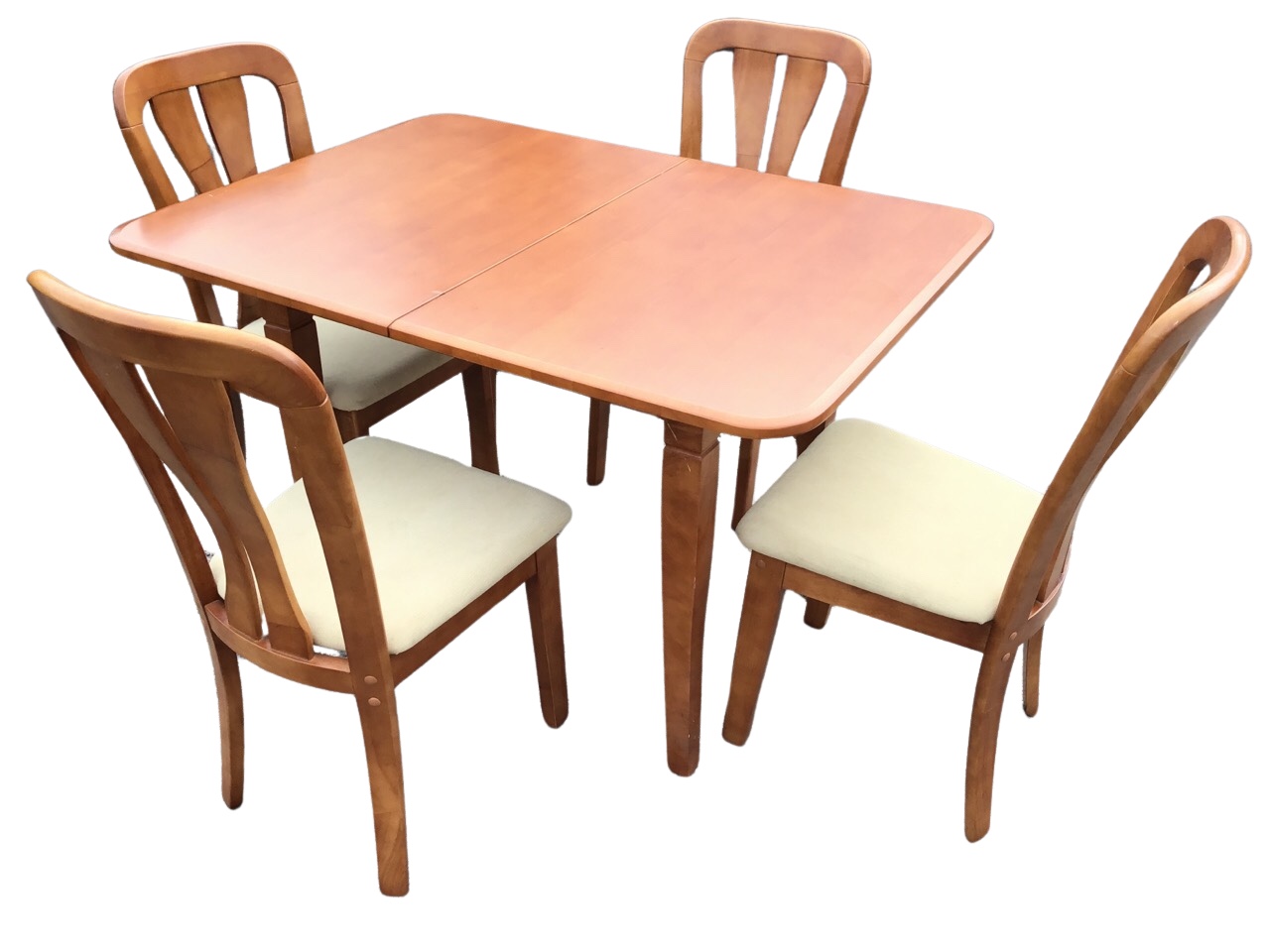 A pale mahogany fold-over dining table, the rounded rectangular top above an apron raised on everted