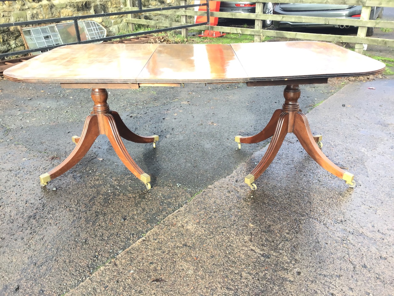 An Edwardian mahogany regency style twin pedestal dining table with spare leaf, the rounded - Image 3 of 3