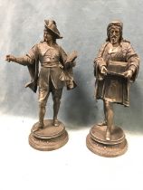 A pair of nineteenth century European faux bronze figurines, an artist and a scholar, the