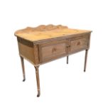 A painted pine washstand with applied ribbon and scrolled decoration, having shaped back and moulded