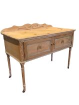 A painted pine washstand with applied ribbon and scrolled decoration, having shaped back and moulded
