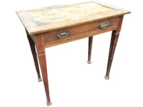 An art nouveau oak writing table, the rectangular top formerly with skiver above a long frieze