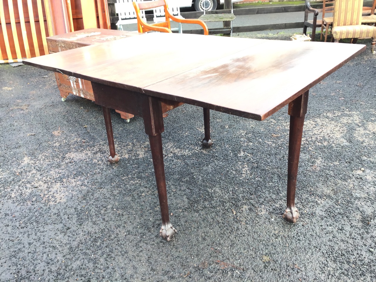 A George III mahogany drop-leaf dining table, the rectangular top with two leaves opening on swing - Image 3 of 3