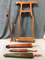 A shaped pine easel - 39in; two copper & brass tapering coaching horns; and three oriental