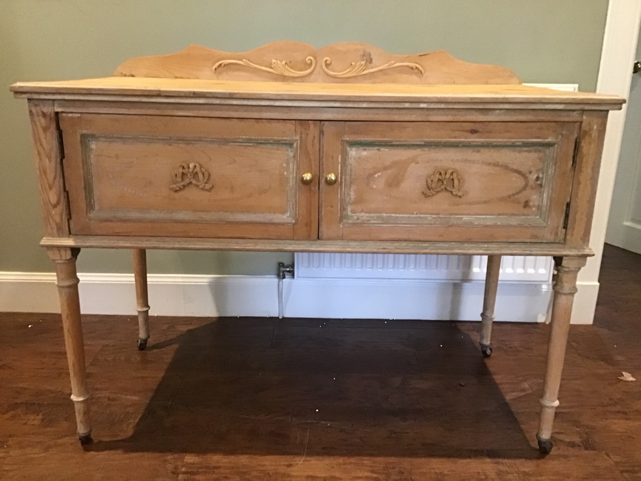 A painted pine washstand with applied ribbon and scrolled decoration, having shaped back and moulded - Image 2 of 3