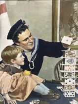A World War I colour print depicting a British sailor building a house of cards with a boy,