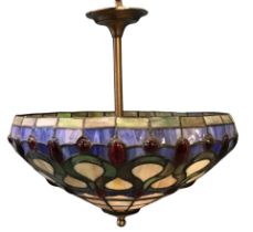 A Tiffany style hanging glass light fitting, with three interior lampholders in a leaded and stained