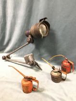 An industrial anglepoise bench lamp; and three miscellaneous oil cans. (4)