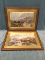 A pair of late Victorian framed prints of cattle watering in the highlands, the oak frames with wide