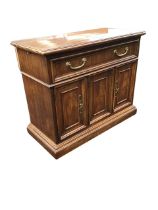 A Drexel Heritage walnut sideboard, the moulded rectangular top with two leaves opening on lopers,