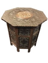 A carved octagonal eastern coffee table, with bone inlaid central circular medallion framed by