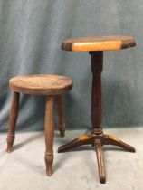 A circular milking type stool on three turned legs; and a hardwood stool on column with four splayed