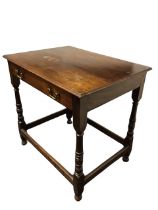 A Georgian oak side table with rectangular moulded top above a long frieze drawer, raised on