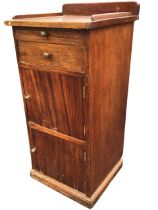 A mahogany ships bedside cabinet, the square top with raised back and sides above a slide, a