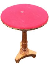 A C19th mahogany occasional table, the circular felt covered top on a turned tapering column, raised