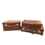 Three miscellaneous C20th leather suitcases. (3)