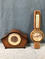 A 50s Smiths oak Westminster chiming mantel clock, the shaped case with circular dial and cream