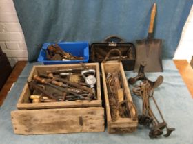 Miscellaneous tools including a hand grinder, a shovel, a cobblers last, rim locks, screwdrivers,