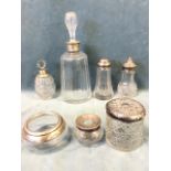 Seven hallmarked silver mounted cut glass vessels - a Hukin & Heath decanter, two silver topped