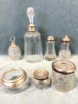 Seven hallmarked silver mounted cut glass vessels - a Hukin & Heath decanter, two silver topped