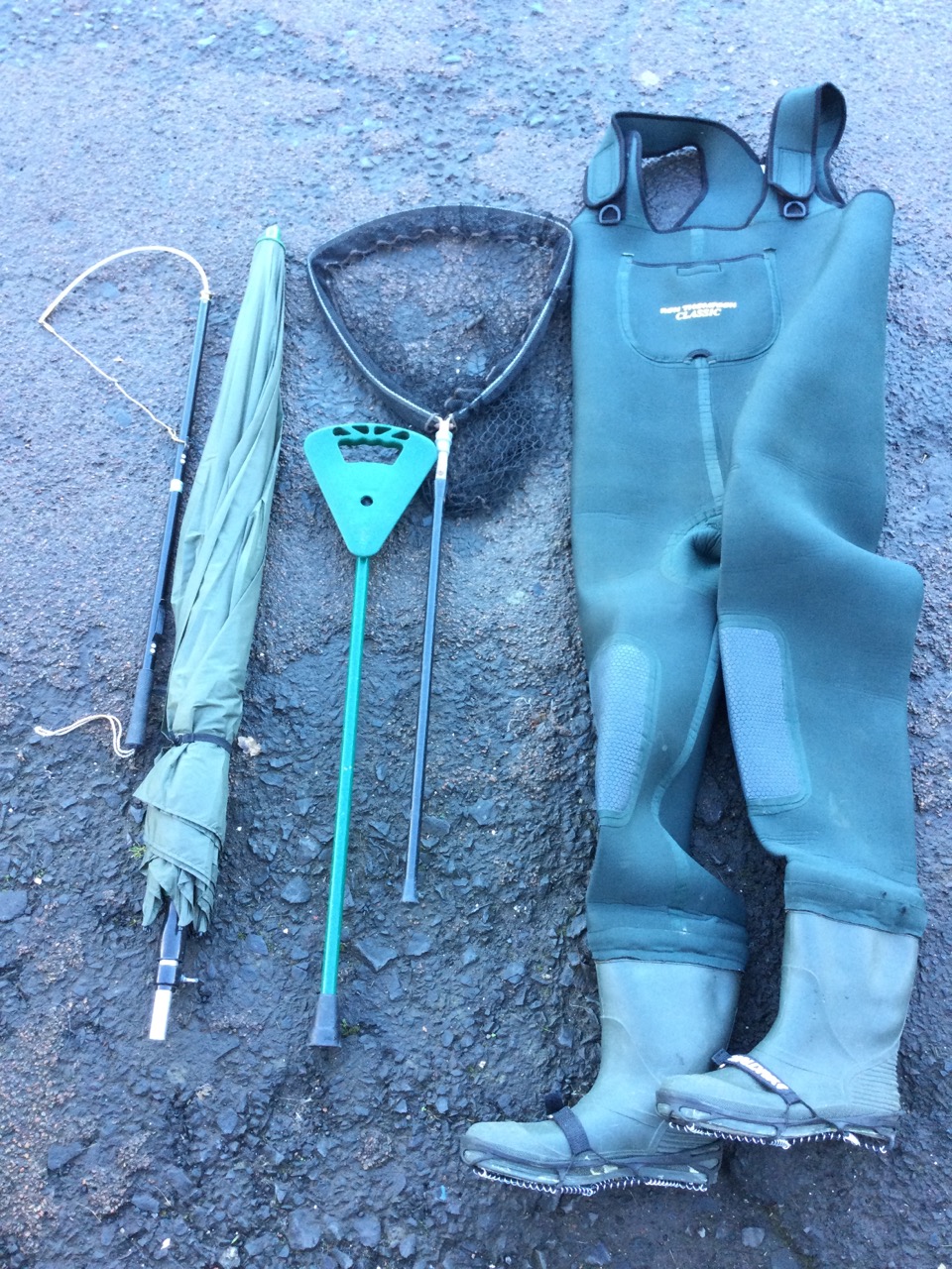 A pair of neoprene chest waders - size 12; a folding landing net; a salmon tailer; a flipstick seat;