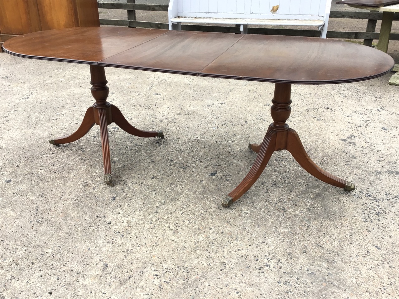 A Georgian style mahogany extending twin pedestal dining table, the crossbanded top with reeded edge - Image 2 of 3