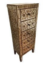 A contemporary mirrored cabinet of five drawers, with painted gilt scrolled decoration to panels,