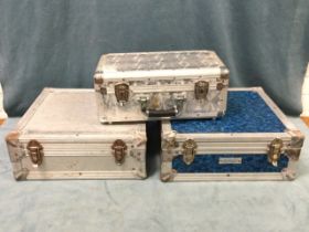 Three aluminium flight cases, the boxes with fitted interiors for CDs. (3)