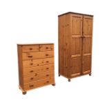 A pine chest of drawers with moulded top above two short and five long knobbed drawers, raised on