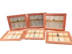 A set of six art deco stained glass window panels, the leaded coloured and patterned glass