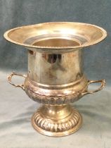 A silver plated wine cooler of urn shape with liner, having gadrooned rim and scrolled handles above