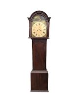 An early nineteenth century mahogany longcase clock, the arched hood and painted dial with roman